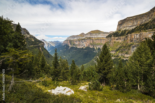 View west along the Ordesa Valley to distant Mondarruego and Otal peaks, Ordesa National Park, Pyrenees, Aragon, Spain photo