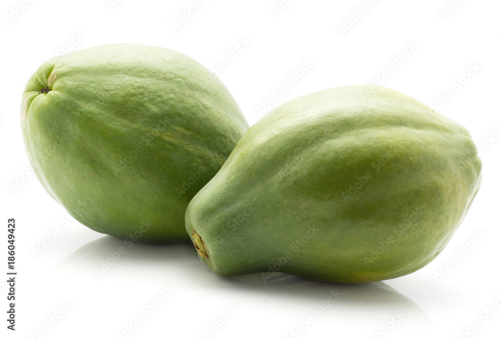 Two green papaya (pawpaw, papaw) isolated on white background. Two green papaya (pawpaw, papaw) isolated on white background.