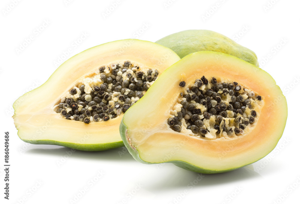 Papaya (pawpaw, papaw) isolated on white background one whole and two sliced halves with orange flesh and seeds. Papaya (pawpaw, papaw) isolated on white background one whole and two sliced halves with orange flesh and seeds.