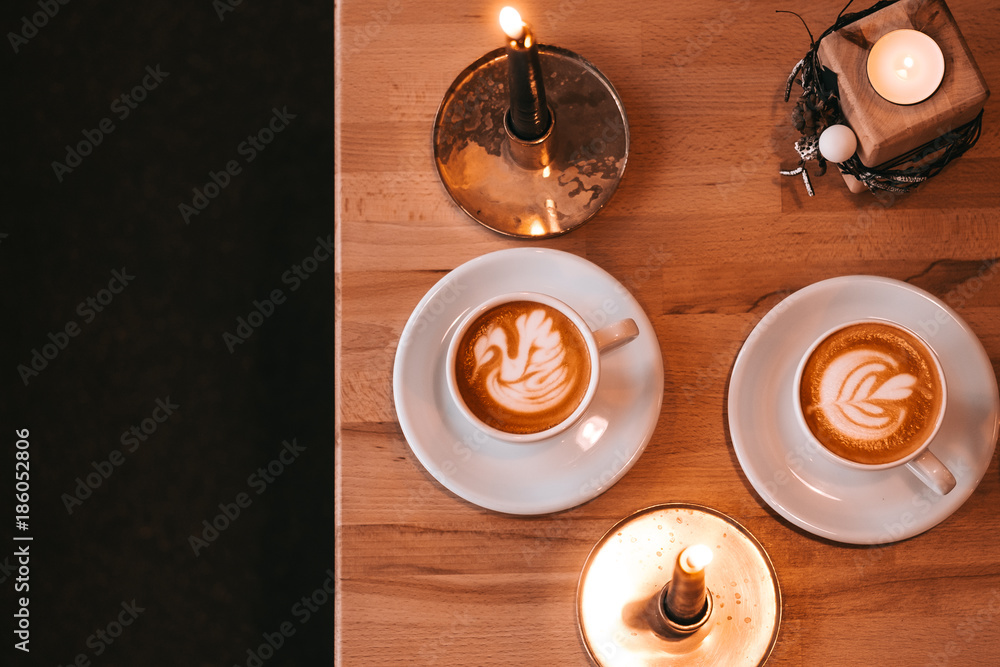 Coffee cups with candle lightings flatlay Coffee cups with candle lightings flatlay