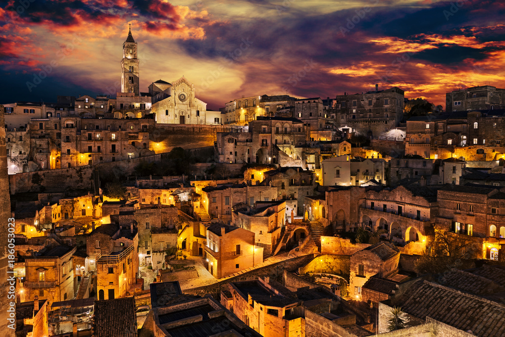 Matera, Basilicata, Italy: landscape of the old town at dusk under a dramatic sky