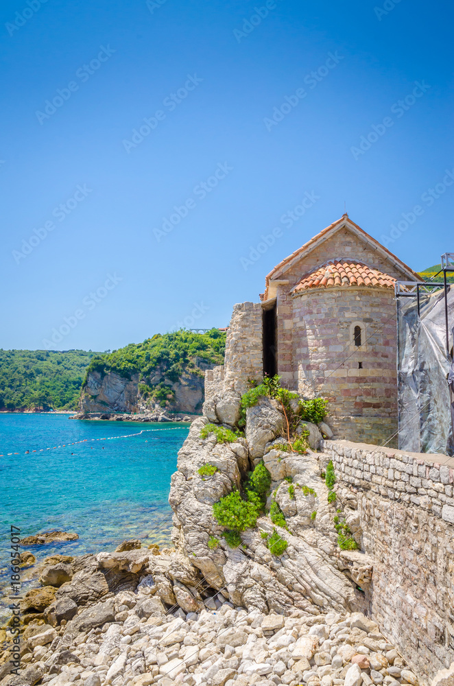 Fototapeta premium Narrow street in old district of Budva, Montenegro