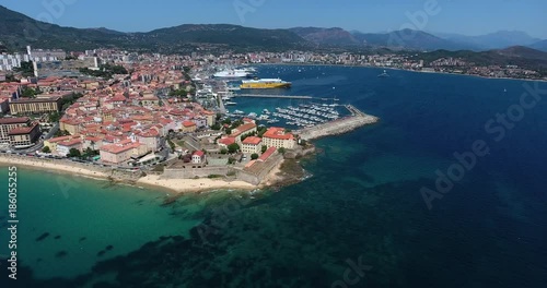 BASTIA, CORSICA, FRANCE – JULY 2016 : Aerial shot of Bastia cityscape on a sunny day with harbor and sea in view photo