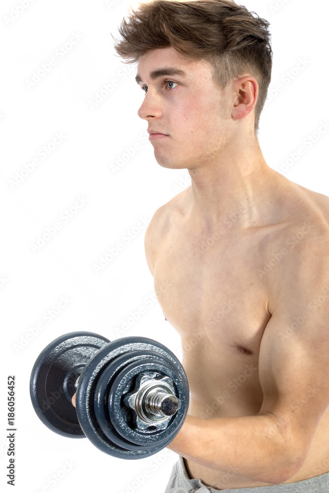 18 Year old teenage boy lifting weights 18 Year old teenage boy lifting weights