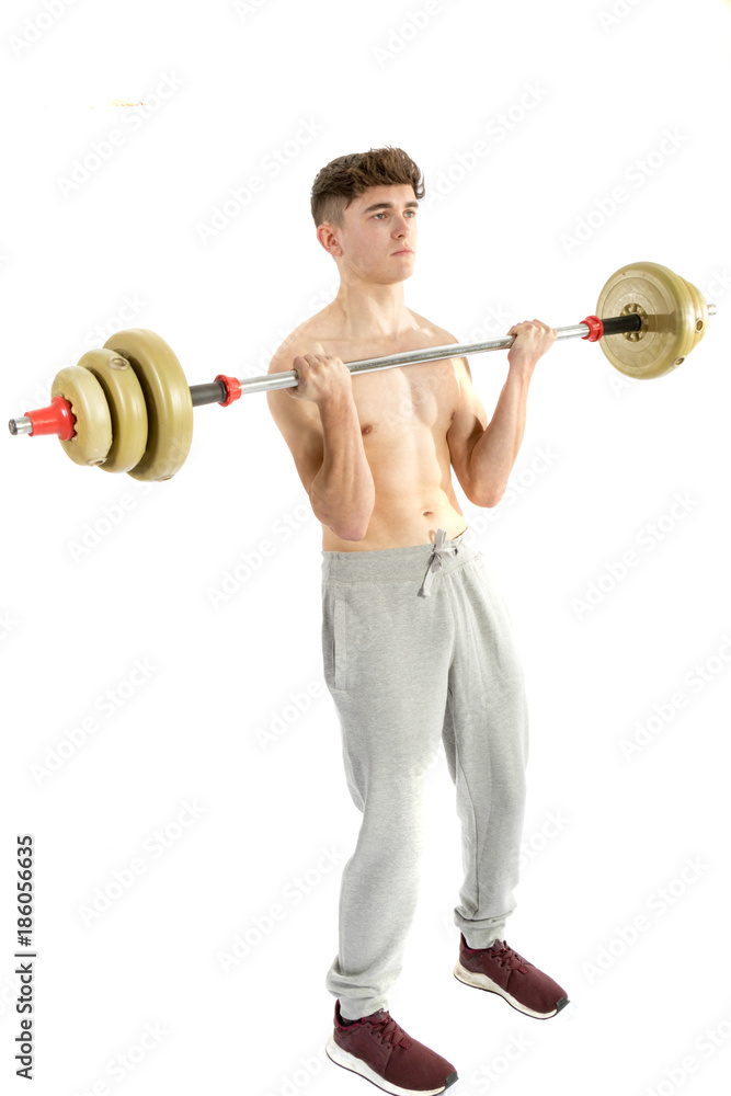 Obraz premium 18 Year old teenage boy lifting weights