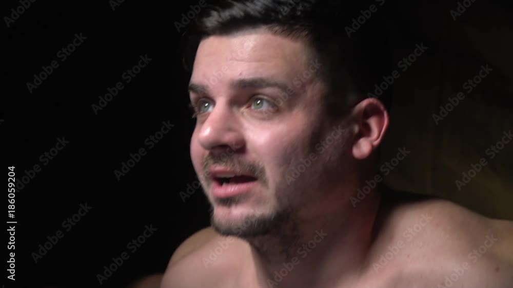 Side view as a man screams and looks up, slow motion Side view as a man screams and looks up, slow motion