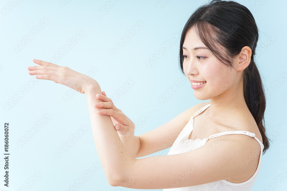 Young woman applying a cream Young woman applying a cream