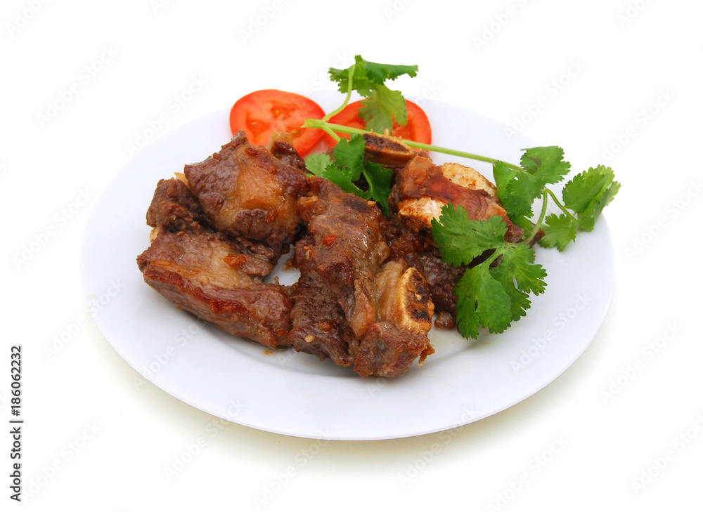 Beef ribs with tomato on white background