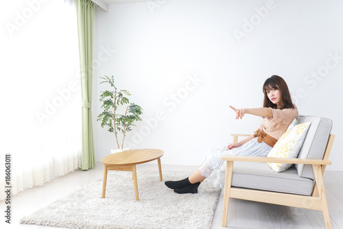 Young woman being relaxed in room
