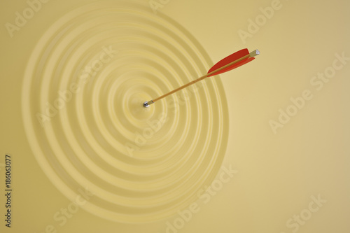 The arrow which makes a wave on yellow background. 3D illustration.