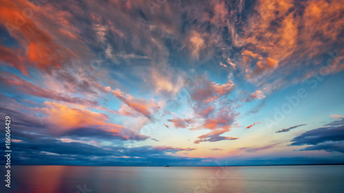 Fototapeta Naklejka Na Ścianę i Meble -  Beautiful Sunset at Lake Superior with Boat