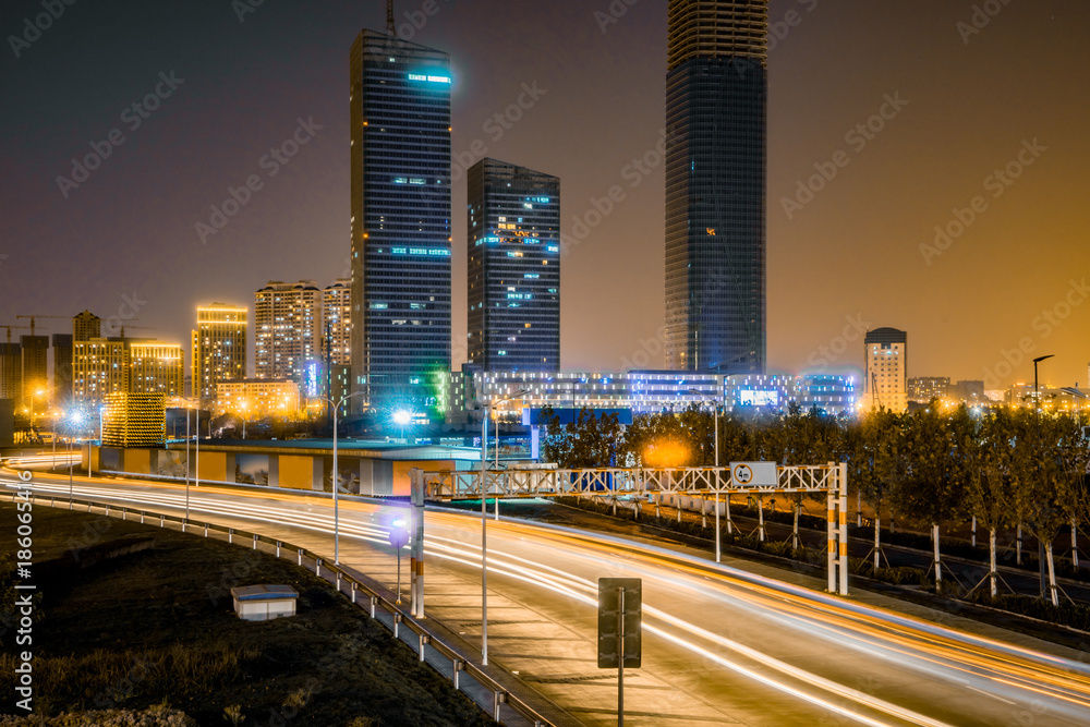 Fototapeta premium traffic light through city at night in china