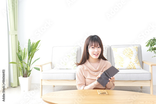 Young woman calculating domestic accounts