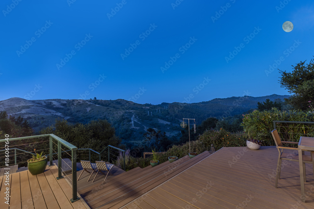 Wooden Deck outdoor patiio at night with amazing hillside view