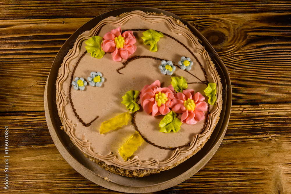 Kiev cake with cream on wooden table. Top view Kiev cake with cream on wooden table. Top view