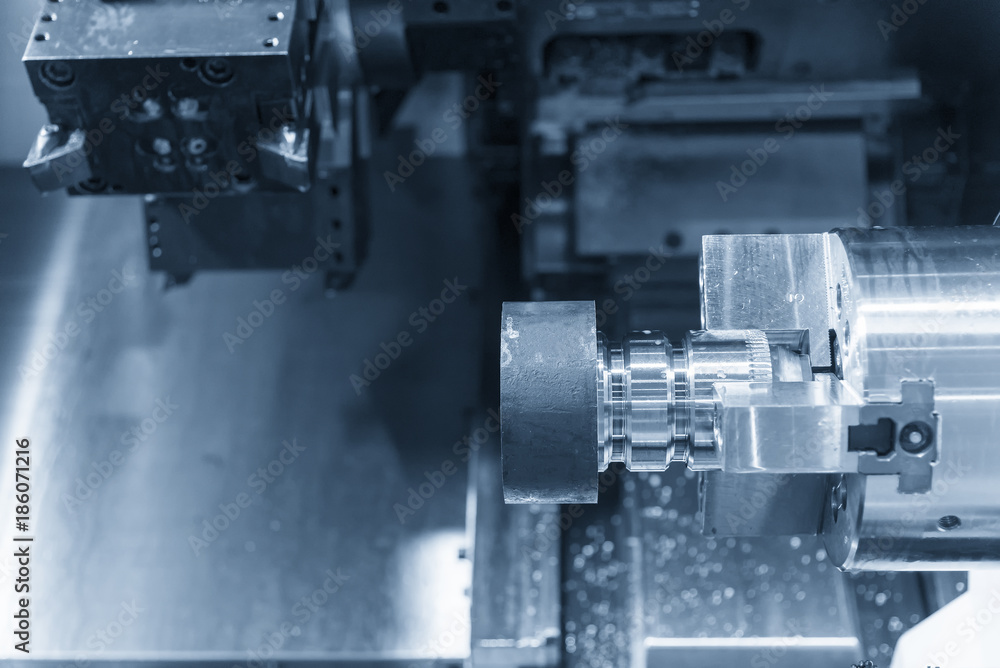 CNC lathe machine (Turning machine) cutting the metal screw thread part .Rotation of aluminium part. CNC lathe machine (Turning machine) cutting the metal screw thread part .Rotation of aluminium part.