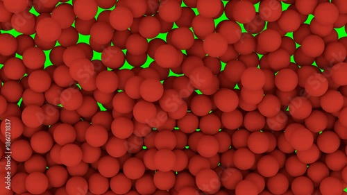 Animated falling and bouncing a lot of red plain Ping-pong balls filling container against green background. Front camera shot.