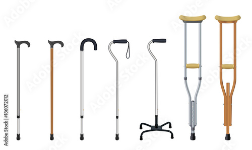 Set of walking sticks and crutches. Telescopic aluminum cane, elegant wooden walking cane, ergonomic canes with curved handle, cane - quadpod, metallic and wooden crutches. Medical assistance and photo