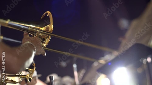 FEBRUARY 27, 2017 Mexico, Campeche. Carnival, dance and parade in colonial town ,street musician playing on instrument, close up trumpet in hands  from below photo