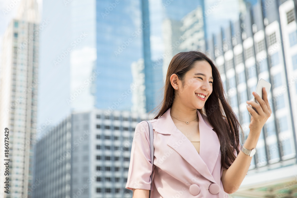 Young Asian lady working outdoors