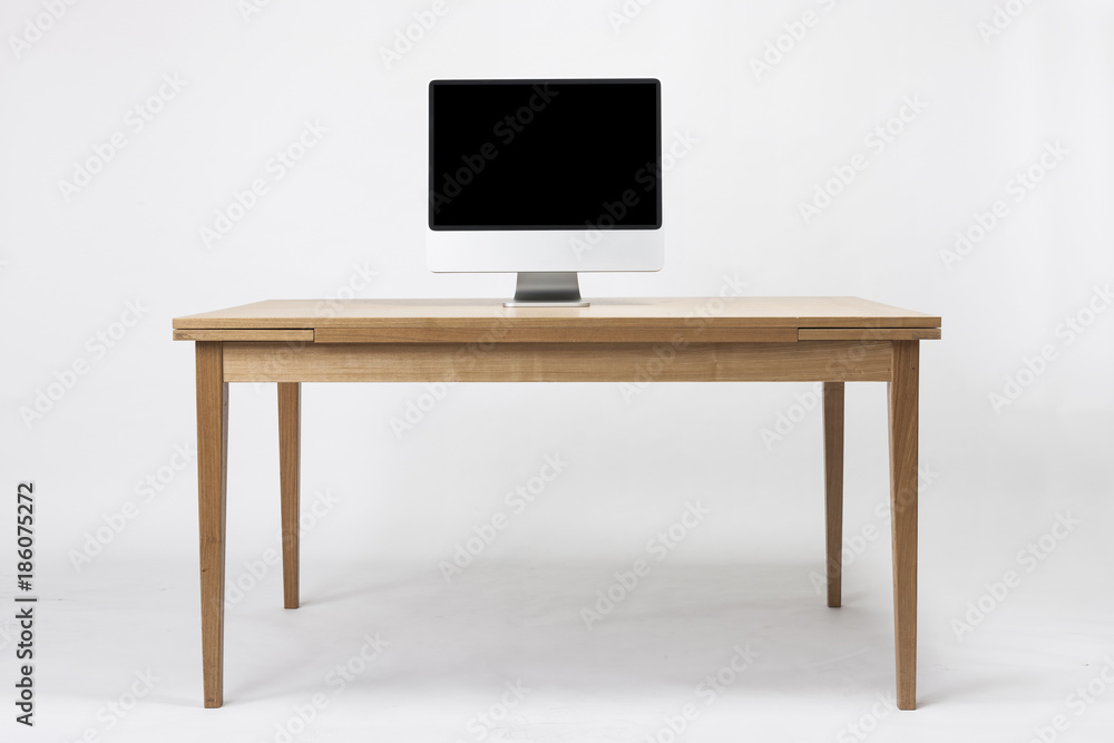 computer on the wood desk isolated on the white background. computer on the wood desk isolated on the white background.