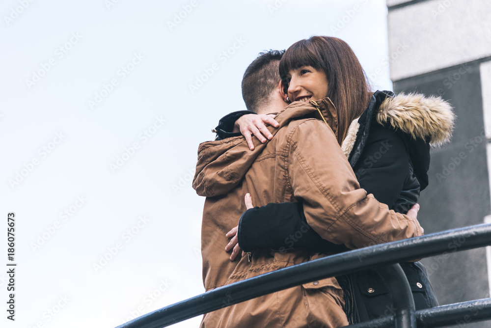 Fototapeta premium Young beautiful in love couple hugging each other on a romantic way .