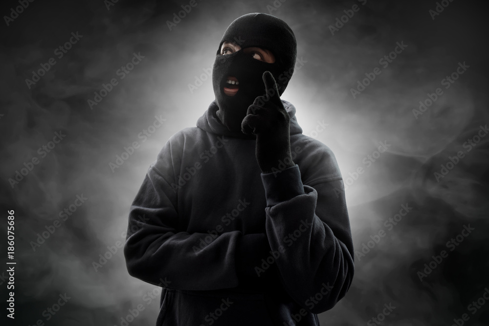 Masked thief thinking Masked thief thinking