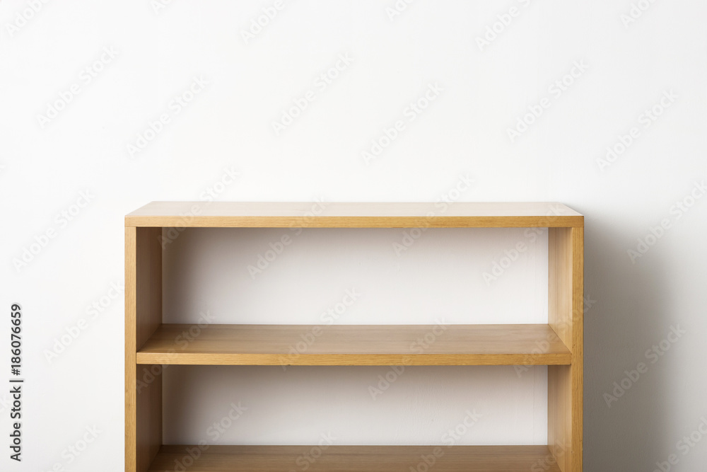 empty solid wood shelf isolated the white background.