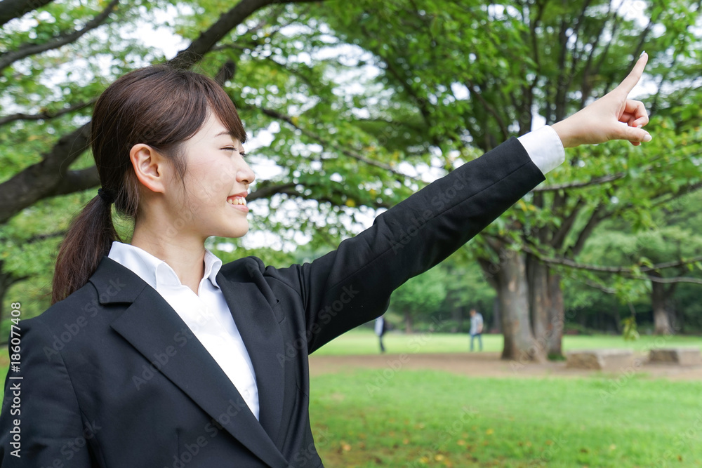 businesswoman pointing to something businesswoman pointing to something