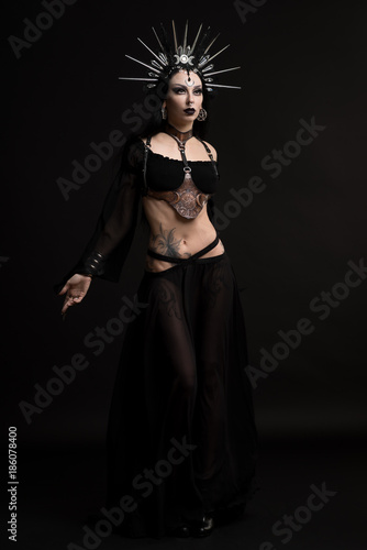 Woman in gothic suit and silver crown