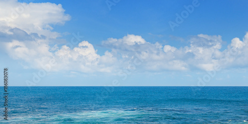 Tropical ocean  beach  high waves and blue sky.