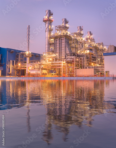 Natural gas combined cycle power plant reflection and Turbine generator with blue sky.