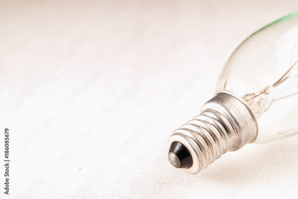 electric light bulb on a white surface electric light bulb on a white surface