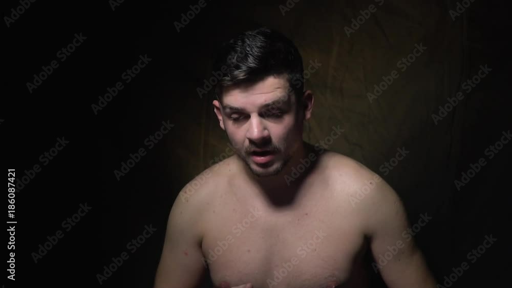 The dark-haired man tries to sneeze The dark-haired man tries to sneeze