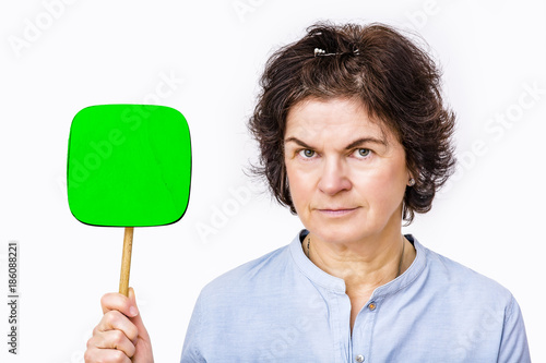 Woman holds up signboard