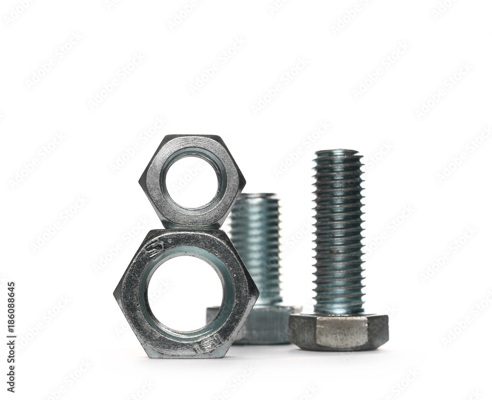 Pile metal screws, bolts and nuts isolated on white background Pile metal screws, bolts and nuts isolated on white background