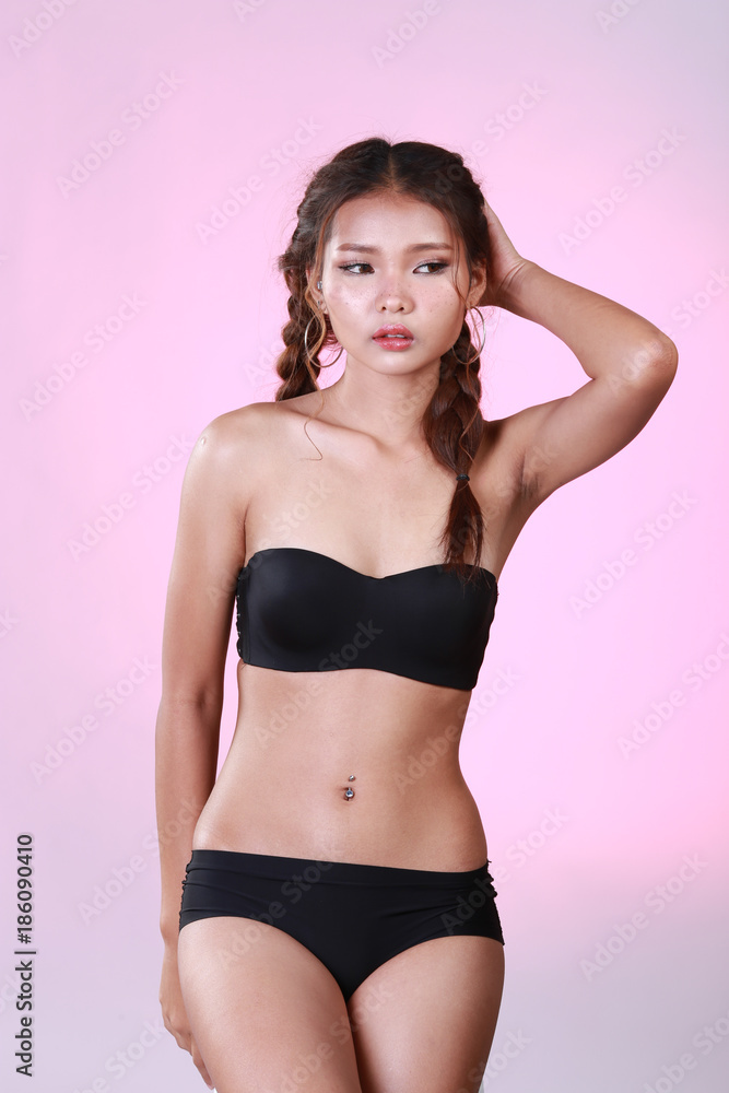 Obraz premium Portrait of sexy woman with pigtail and black underwear