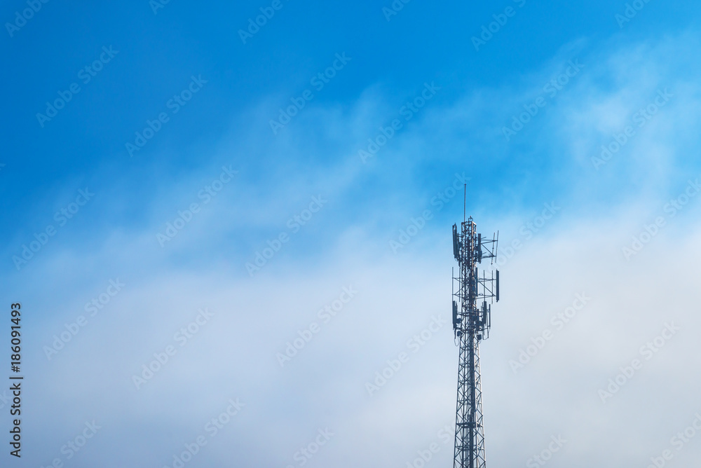 Fototapeta premium Telecommunications equipment, Cell Phone Antenna Tower, Wireless communication, Mobile phone tower, with mist in morning sky.