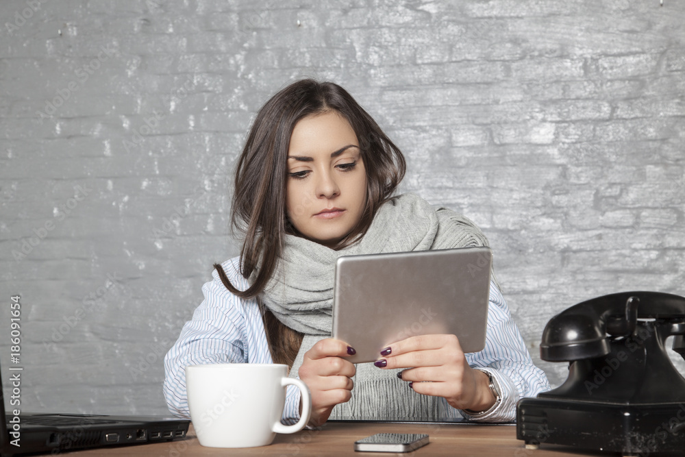 ill business woman instead of working is reads something ill business woman instead of working is reads something