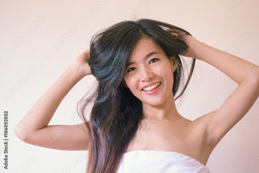 Beauty Skincare concept- Young Asian woman after shower smiling Beauty Skincare concept- Young Asian woman after shower smiling