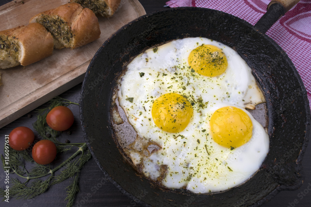 appetizing fried eggs in an old frying pan appetizing fried eggs in an old frying pan