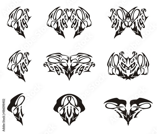 Fototapeta Naklejka Na Ścianę i Meble -  Tribal tiger head text elements. Stylization of the aggressive tiger head in the form of text writing and the ornate elements formed from her