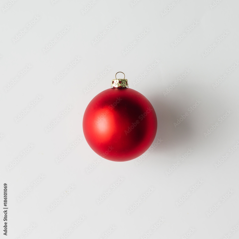 Minimal red Christmas bauble on bright background. Flat lay. HOliday concept. Minimal red Christmas bauble on bright background. Flat lay. HOliday concept.