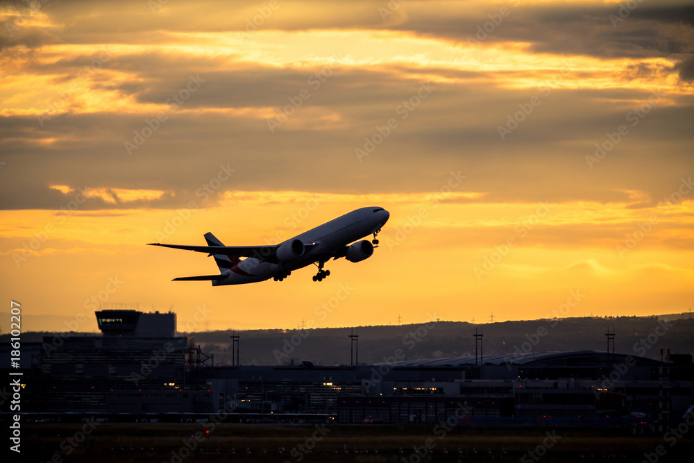 Silhouette of airplane at sunset Silhouette of airplane at sunset