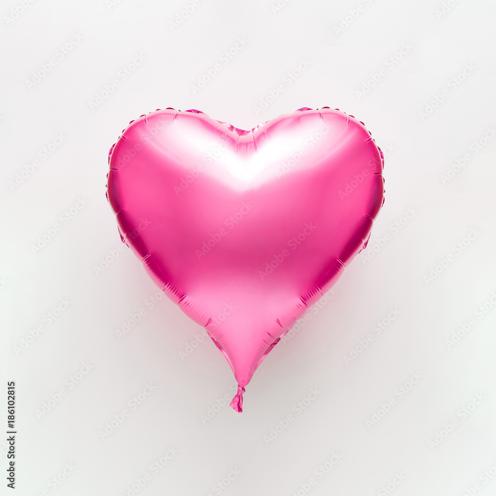 Pink heart balloon on bright background. Minimal love concept.