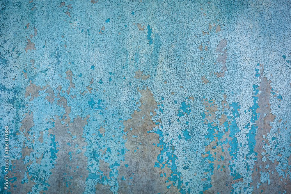 the texture of the peeling paint on the sheet iron. old paint texture on metal
