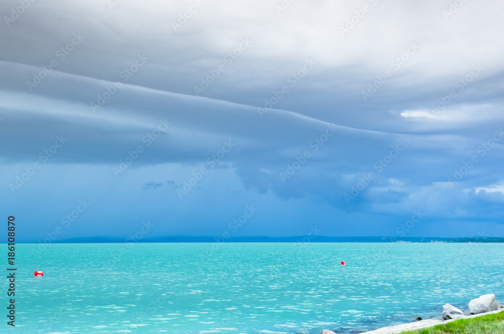 Dramatic before storm view at a turquoise lake Dramatic before storm view at a turquoise lake
