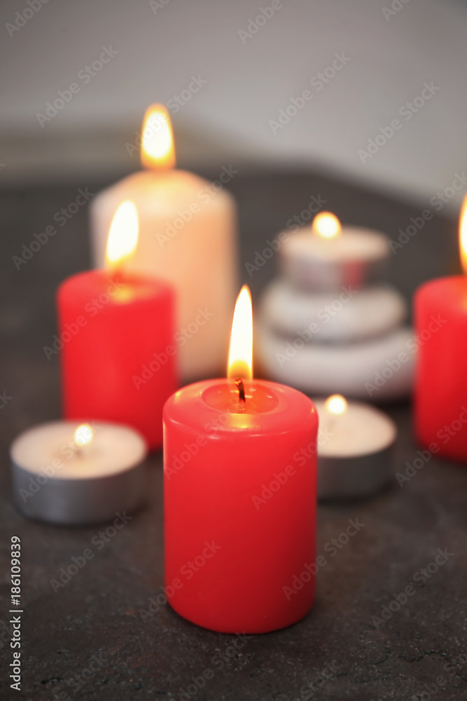 Burning candles on table Burning candles on table