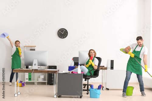Team of young cleaning serv...