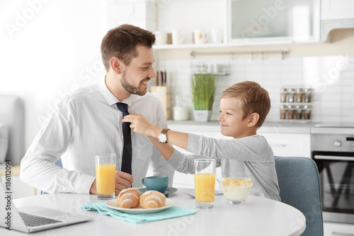 Father with son having brea...
